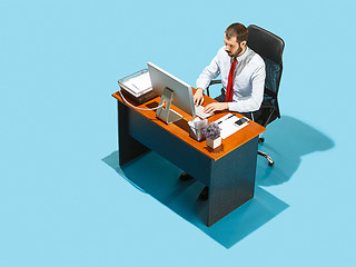 Image showing Shot from above of a stylish business man working on a laptop.