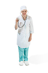 Image showing Beautiful young woman in white coat posing at studio. Full length studio shot isolated on white.