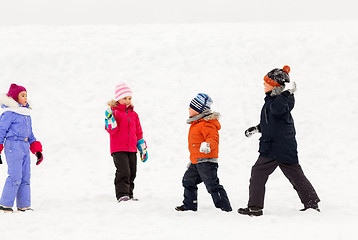 Image showing happy little kids playing outdoors in winter