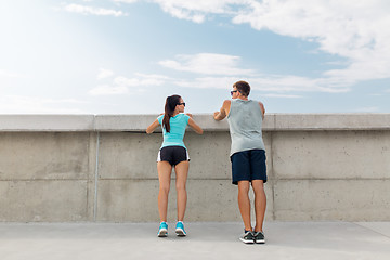 Image showing happy couple exercising outdoors