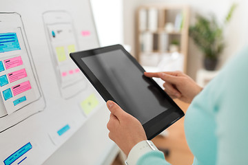 Image showing close up of ui designer with tablet pc at office