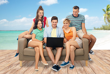 Image showing friends with laptop over tropical beach