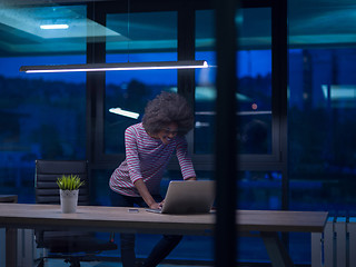 Image showing black businesswoman using a laptop in startup office