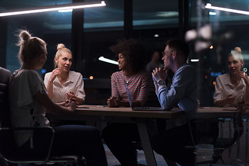 Image showing Multiethnic startup business team in night office