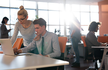 Image showing Two Business People Working With laptop in office