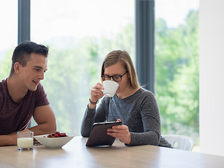 Image showing couple enjoying morning coffee and strawberries