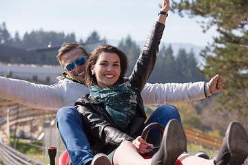Image showing couple enjoys driving on alpine coaster