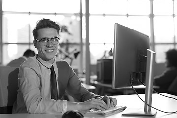 Image showing businessman working using a computer in startup office