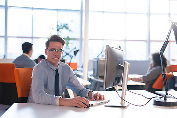 Image showing businessman working using a computer in startup office