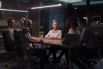 Image showing Multiethnic startup business team in night office