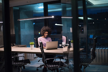 Image showing black businesswoman using a laptop in startup office