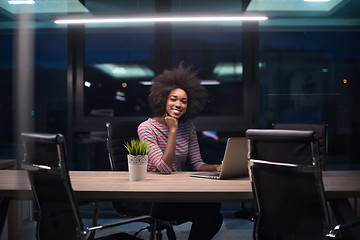 Image showing black businesswoman using a laptop in startup office