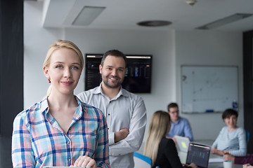 Image showing Business People Working With Tablet in startup office