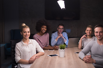 Image showing Multiethnic startup business team in night office