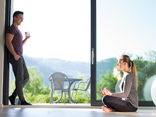 Image showing couple on the door of their luxury home