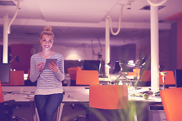 Image showing woman working on digital tablet in night office