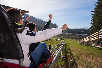 Image showing couple enjoys driving on alpine coaster