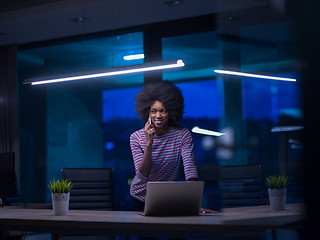 Image showing black businesswoman using a laptop in startup office