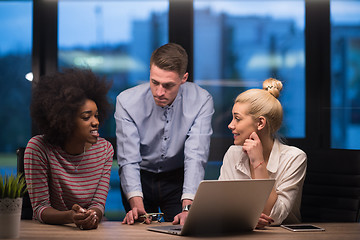 Image showing Multiethnic startup business team in night office