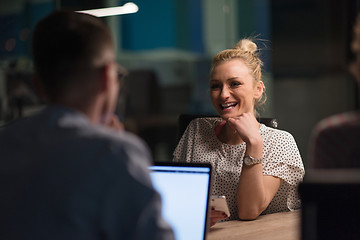 Image showing Multiethnic startup business team in night office