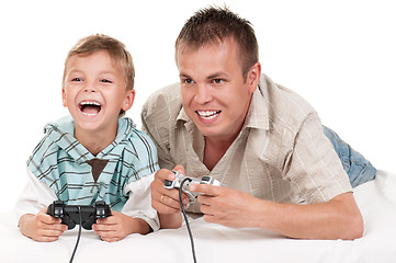 Image showing Dad and son playing with Joystick