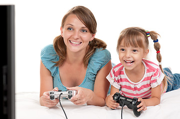 Image showing Mom and daughter playing with Joystick