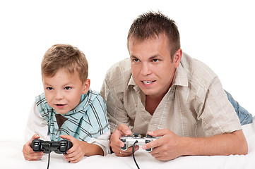 Image showing Dad and son playing with Joystick