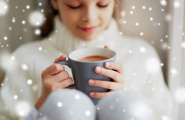 Image showing close up of girl in winter sweater with cacao mug