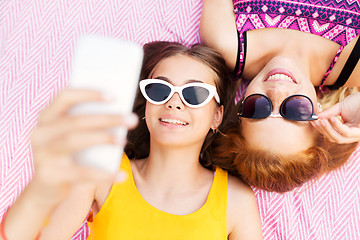 Image showing teenage girls in sunglasses taking selfie