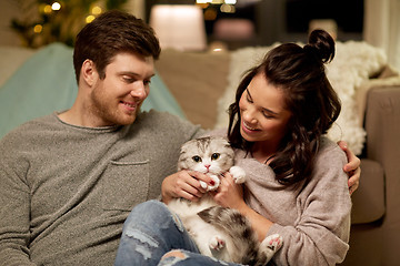 Image showing happy couple with cat at home