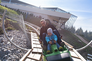 Image showing father and son enjoys driving on alpine coaster