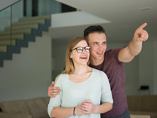 Image showing couple hugging in their new home
