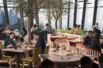 Image showing Young parents enjoying lunch time with their children