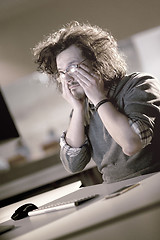 Image showing businessman relaxing at the desk