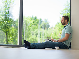 Image showing man on the floor enjoying relaxing lifestyle