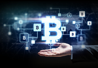 Image showing buisnessman hand with bitcoin block chain