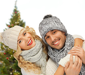 Image showing happy couple hugging over christmas tree
