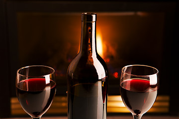 Image showing Wine and fireplace