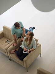 Image showing couple relaxing at  home with tablet computers