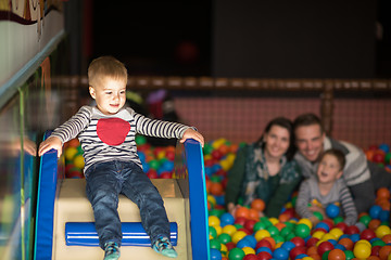 Image showing young parents with kids in a children\'s playroom
