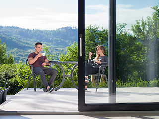 Image showing couple enjoying morning coffee and breakfast