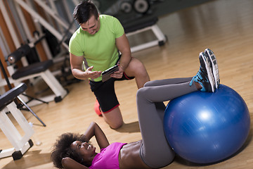 Image showing pilates  workout with personal trainer at gym