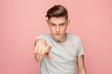 Image showing The overbearing businessman point you and want you, half length closeup portrait on pink background.