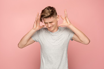 Image showing Handsome man in stress isolated on pink