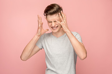 Image showing Handsome man in stress isolated on pink