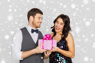 Image showing happy couple with christmas gift