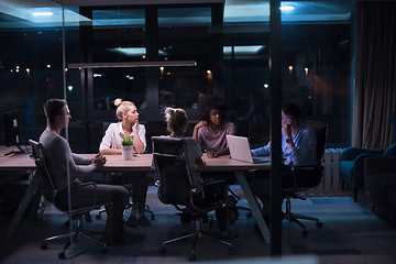 Image showing Multiethnic startup business team in night office