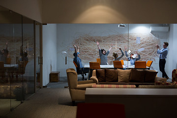 Image showing Group of young business people throwing documents