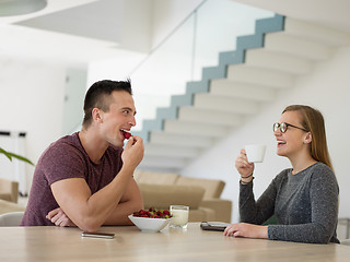 Image showing couple enjoying morning coffee and strawberries