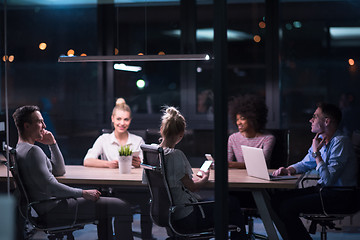 Image showing Multiethnic startup business team in night office